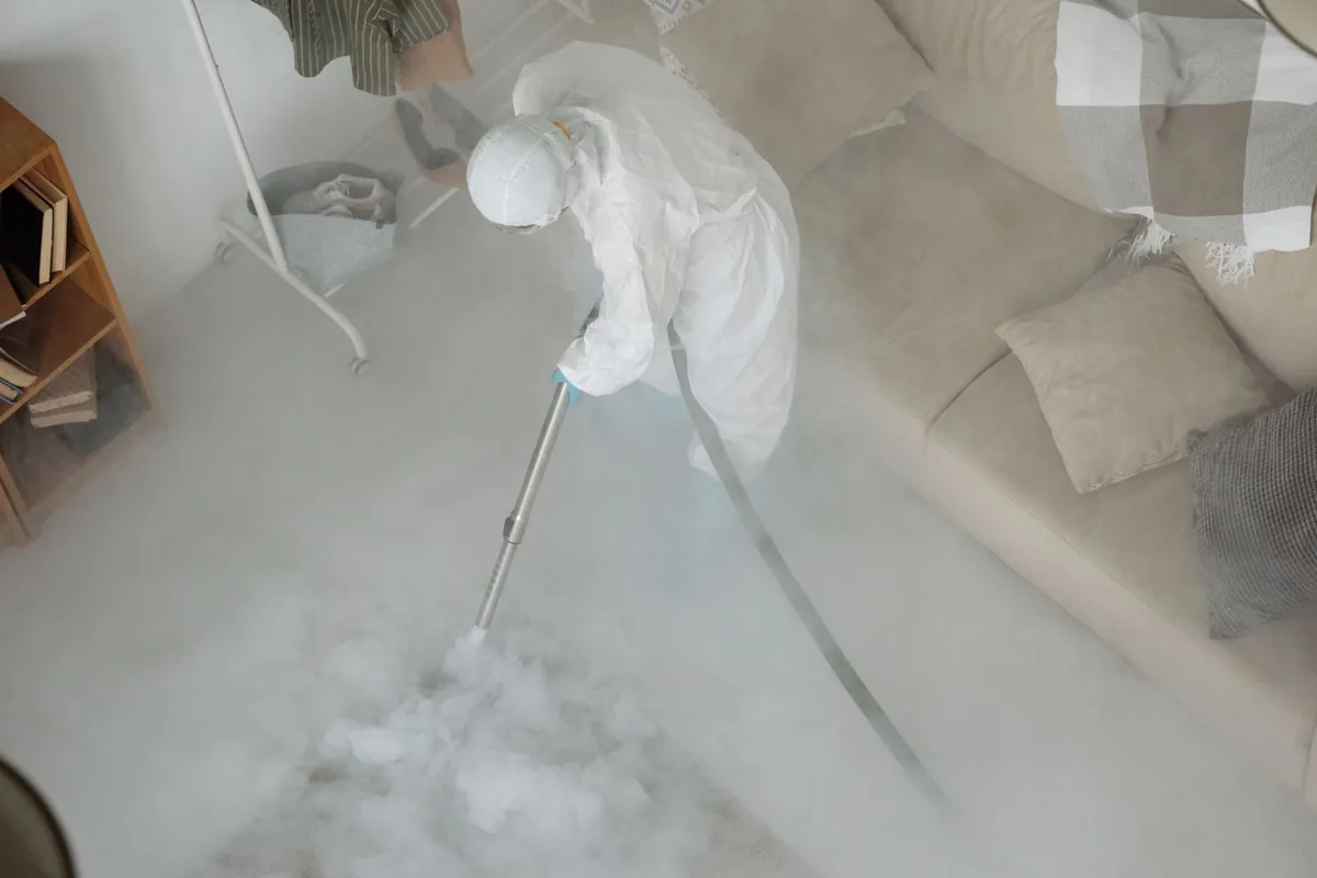 Biohazard cleanup technician in protective equipment, Smithville, NJ